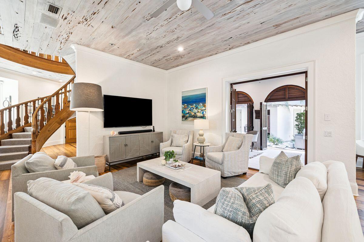 216 Round Road Rosemary Beach, FL 32461 - Photo 15 of 58 a living room with furniture a ceiling fan and a flat screen tv
