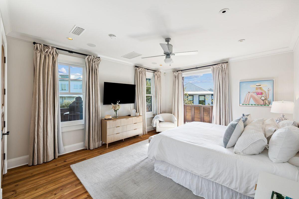 216 Round Road Rosemary Beach, FL 32461 - Photo 30 of 58 a bedroom with a large bed a flat screen tv and a couch