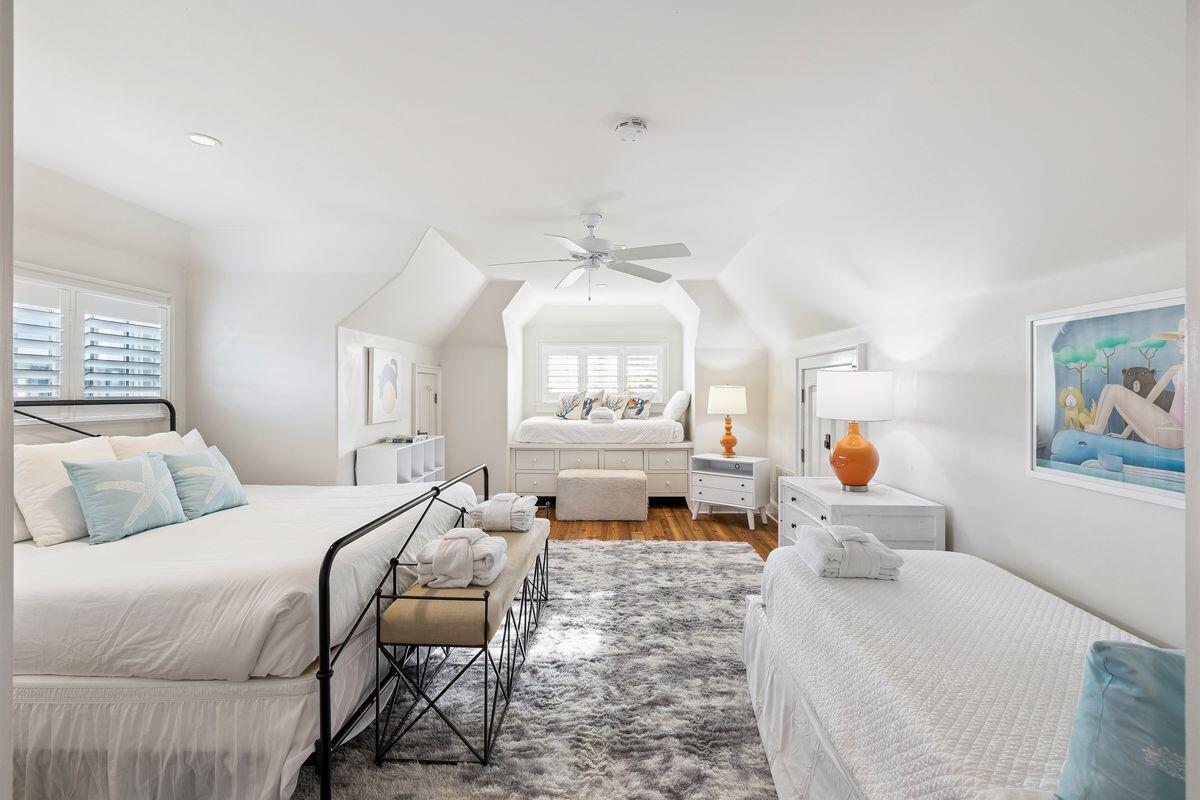 216 Round Road Rosemary Beach, FL 32461 - Photo 40 of 58 a bedroom with a large bed and a chandelier