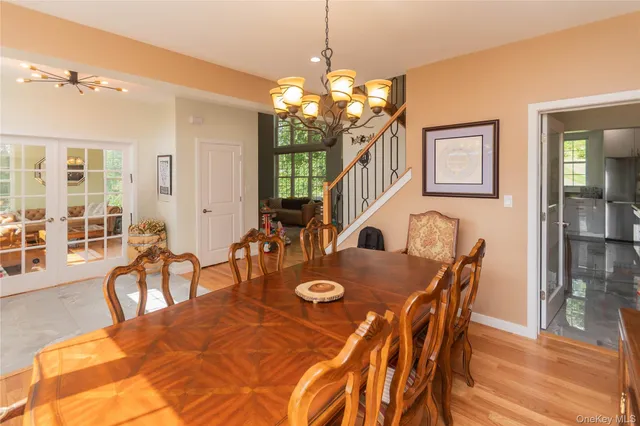 a view of a dining room with furniture and chandelier