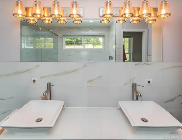 a bathroom with a bathtub and a window