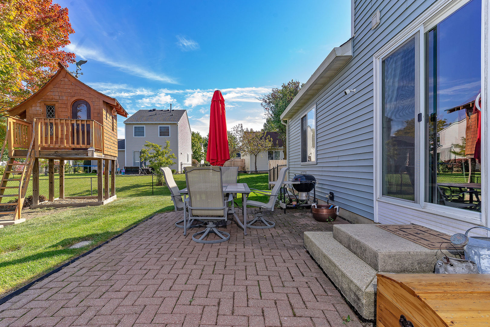 1394 Ridge Road South Elgin, IL 60177 - Photo 16 of 22 a view of a house with backyard porch and sitting area