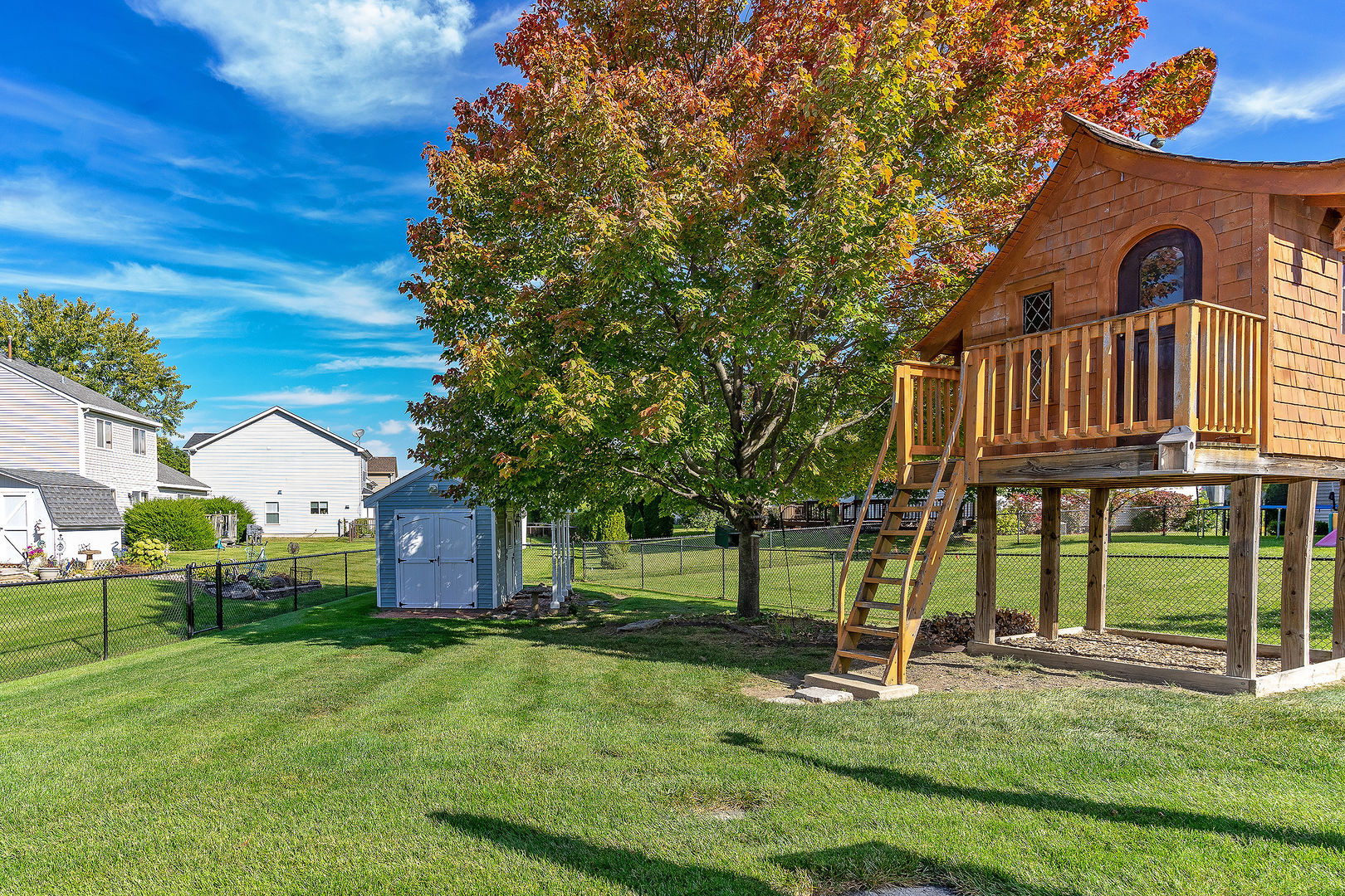 1394 Ridge Road South Elgin, IL 60177 - Photo 17 of 22 a view of backyard with a garden and deck