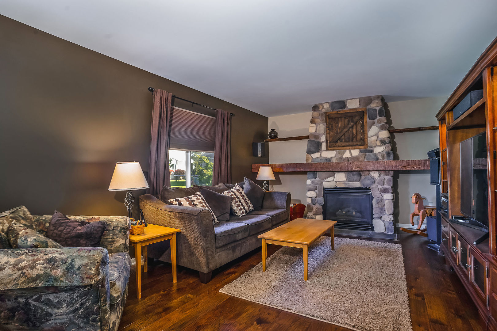 1394 Ridge Road South Elgin, IL 60177 - Photo 5 of 22 a living room with furniture and a fireplace