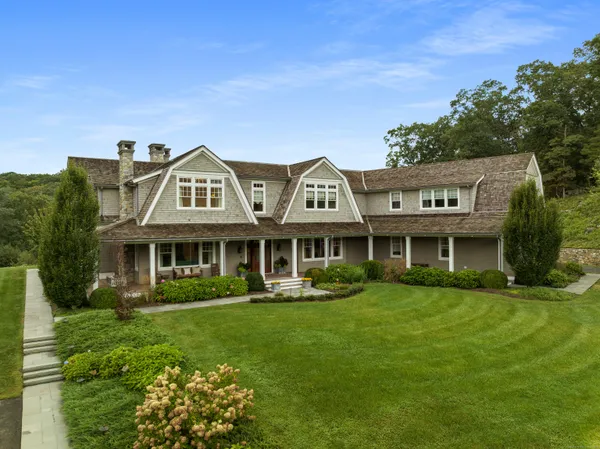 a front view of a house with garden