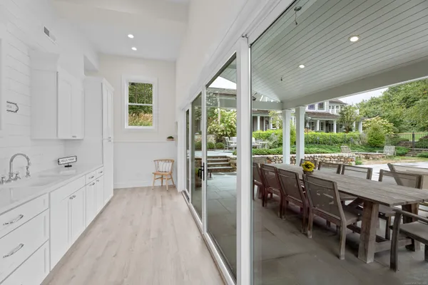 a very nice looking dining room with a large window