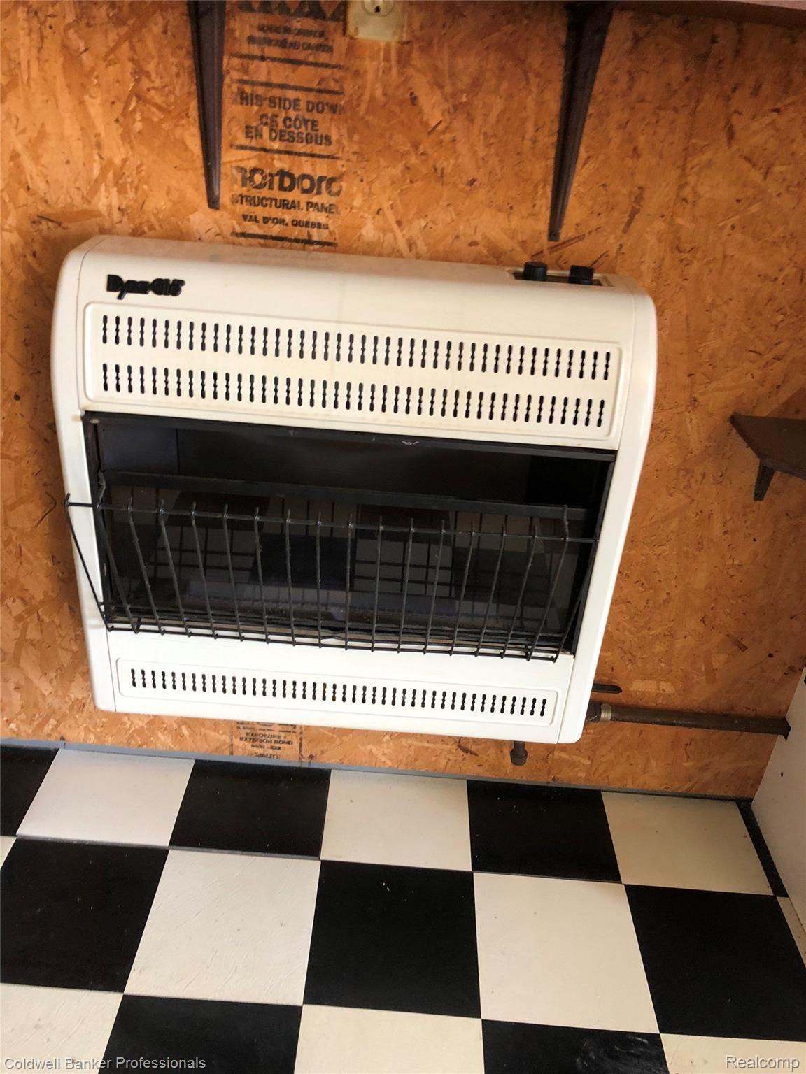 9565 North River Road Algonac, MI 48001 - Photo 16 of 18 Fireplace in Garage.jpg