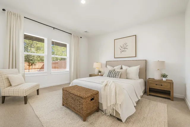 a bedroom with a bed and a couch