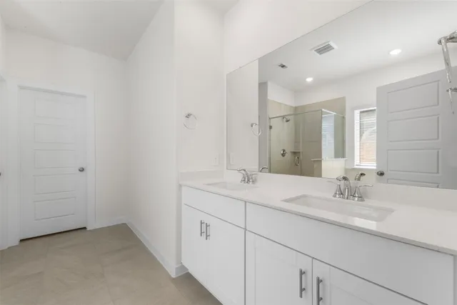 a bathroom with a bathtub and shower