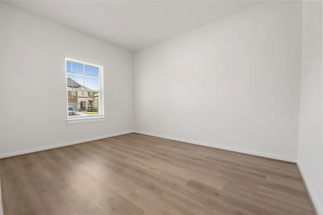 an empty room with a empty space and window