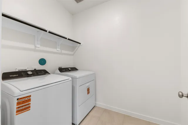 a view of a yard with wooden fence