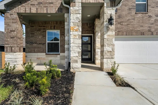 a stone house with a outdoor space