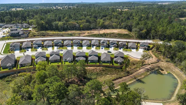 an aerial view of residential house with outdoor space and swimming pool