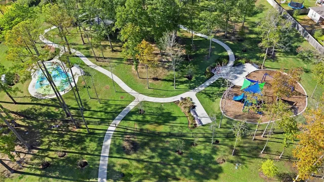 an aerial view of a yard with plants and large trees