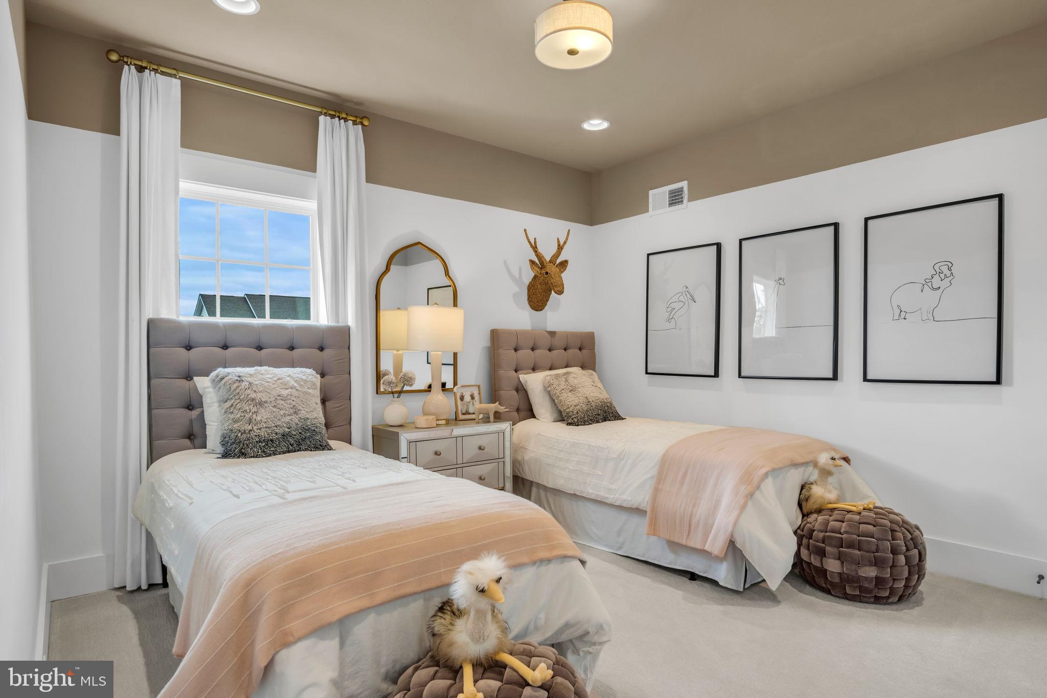 39 Reedgrass Way Gettysburg, PA 17325 - Photo 16 of 44 a bedroom with two beds and a large window