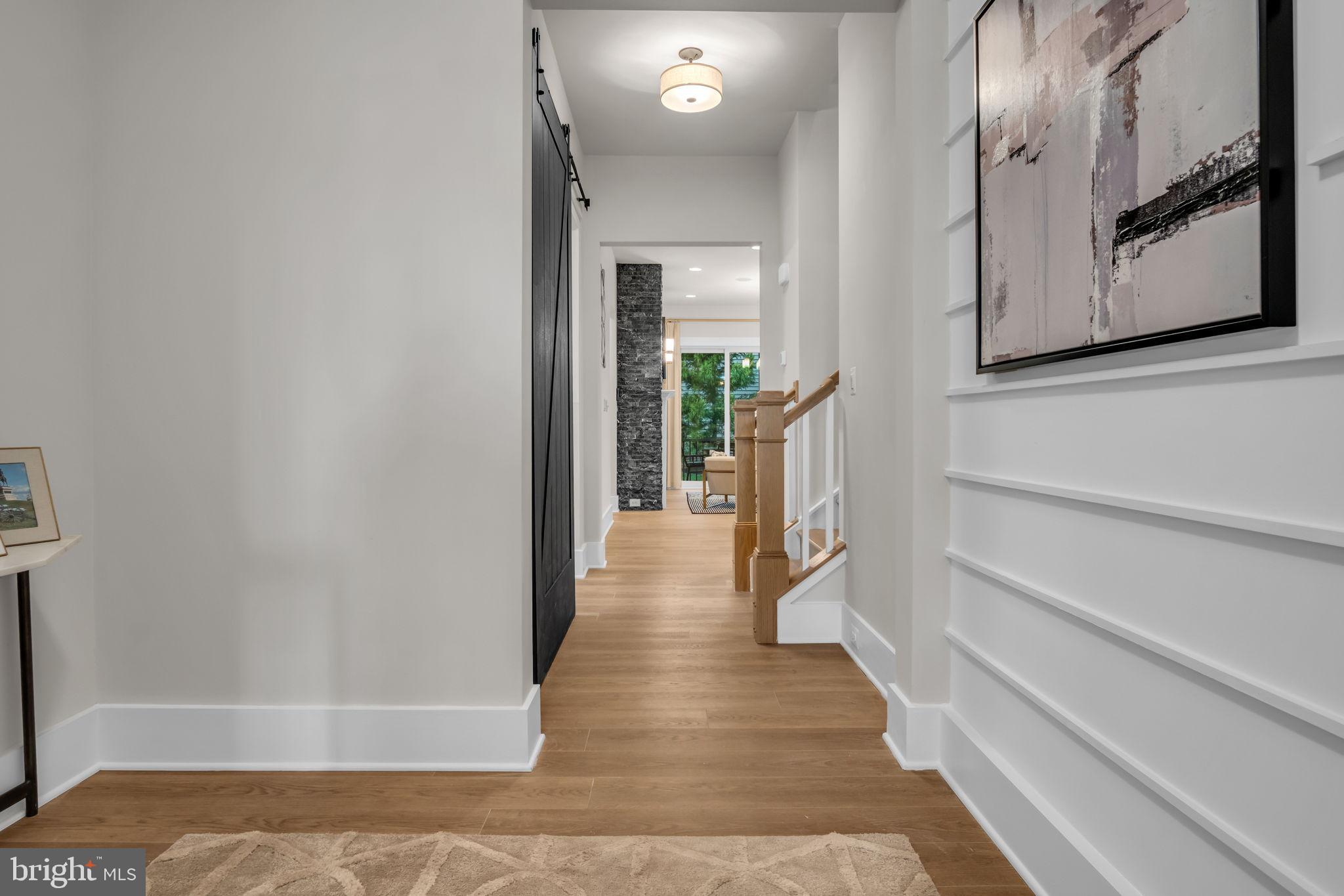 39 Reedgrass Way Gettysburg, PA 17325 - Photo 18 of 44 a view of a hallway with wooden floor and staircase