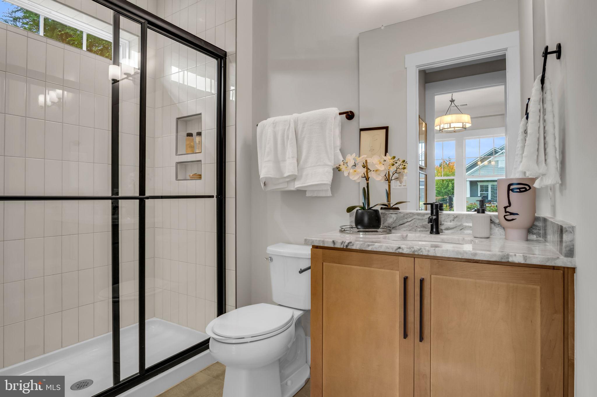 39 Reedgrass Way Gettysburg, PA 17325 - Photo 22 of 44 a bathroom with a granite countertop sink a toilet and a mirror