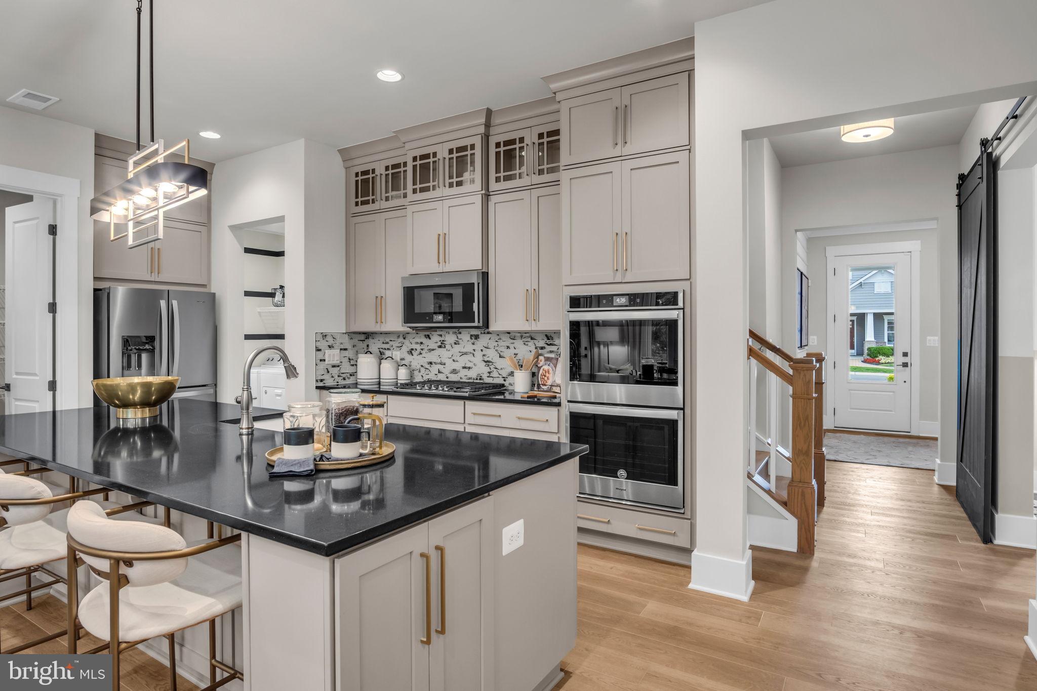 39 Reedgrass Way Gettysburg, PA 17325 - Photo 27 of 44 a kitchen with stainless steel appliances granite countertop a stove and cabinets