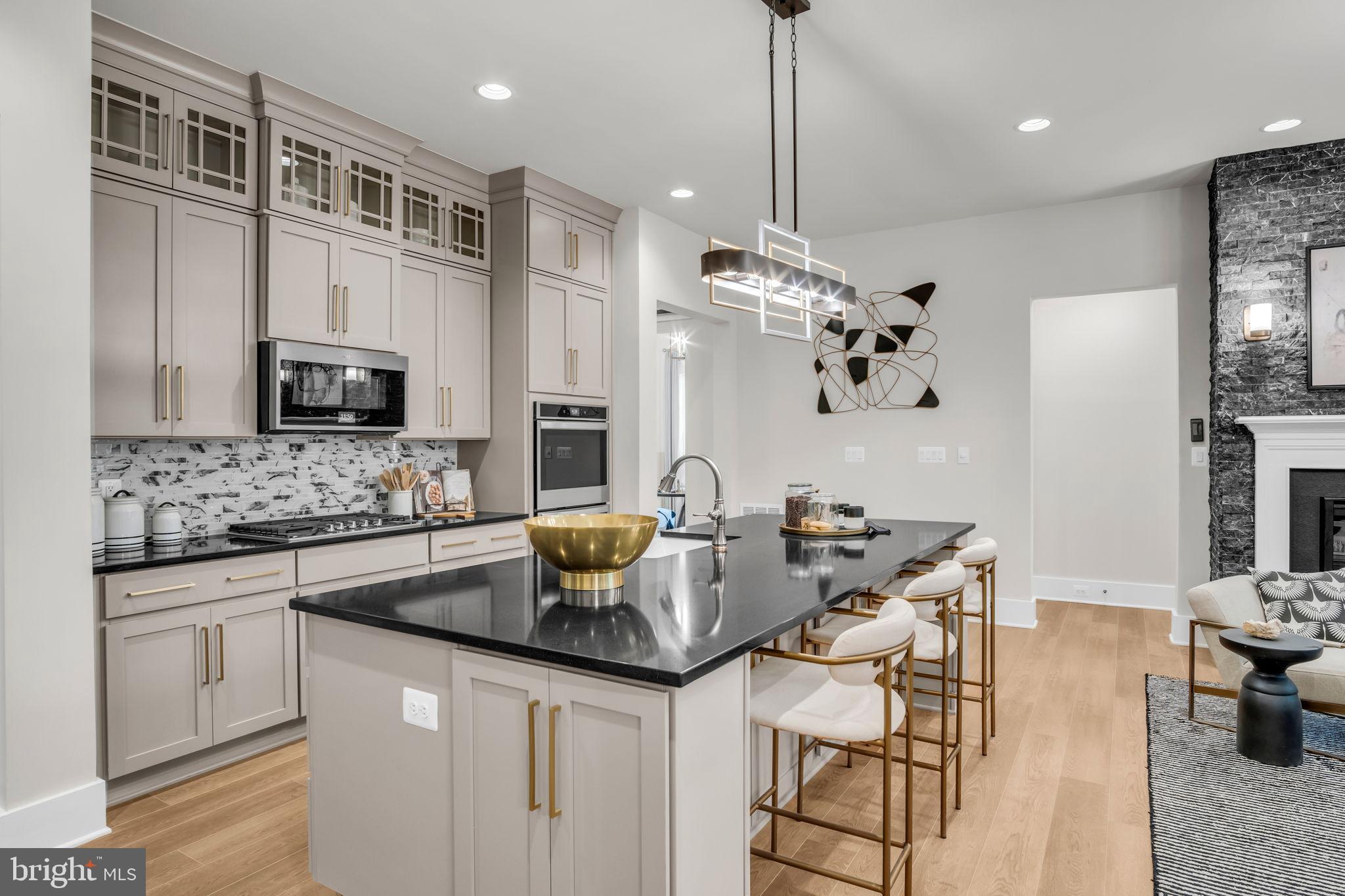 39 Reedgrass Way Gettysburg, PA 17325 - Photo 29 of 44 a kitchen with kitchen island granite countertop a sink cabinets and stainless steel appliances