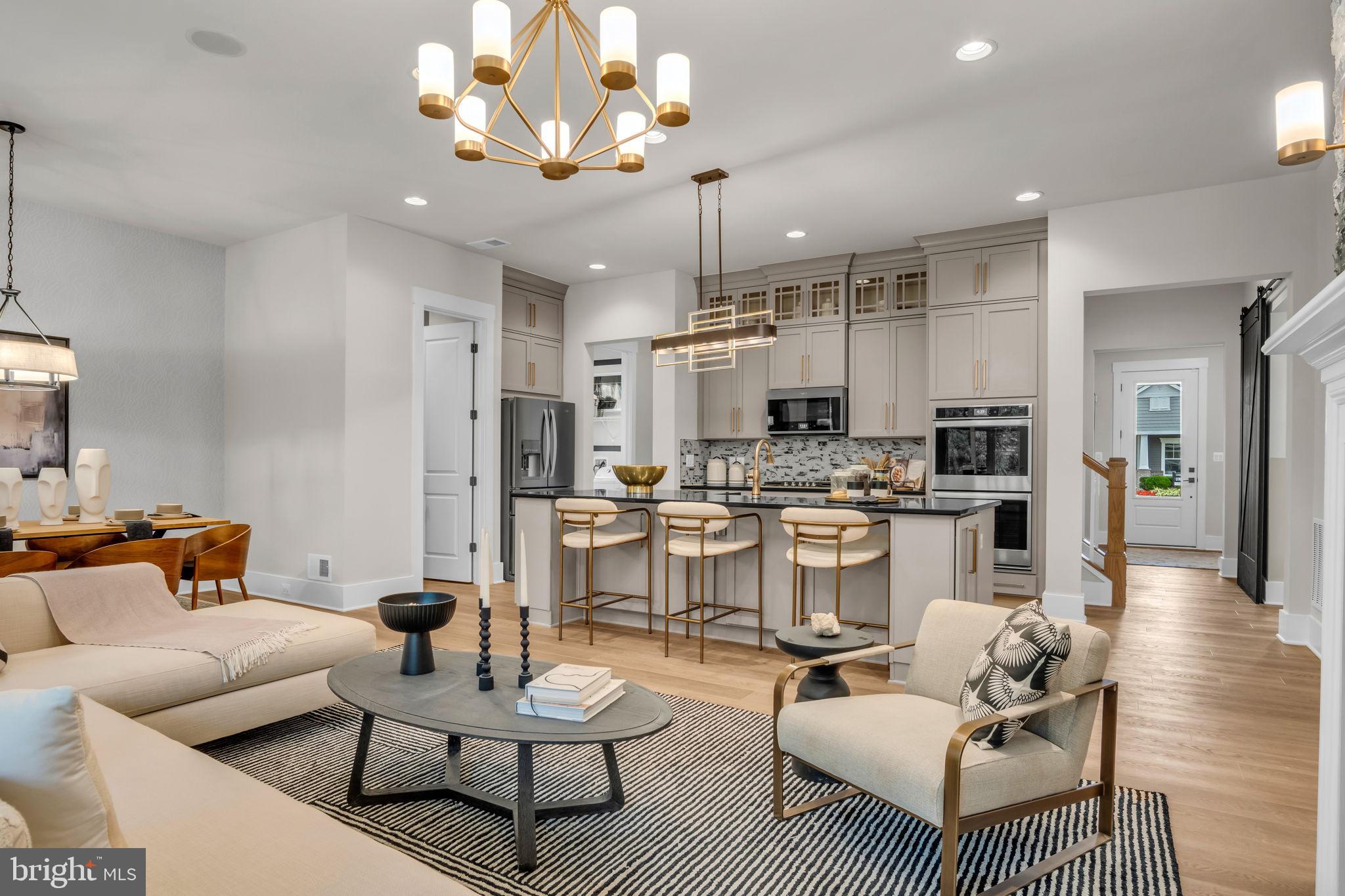 39 Reedgrass Way Gettysburg, PA 17325 - Photo 4 of 44 a living room with furniture kitchen and a chandelier