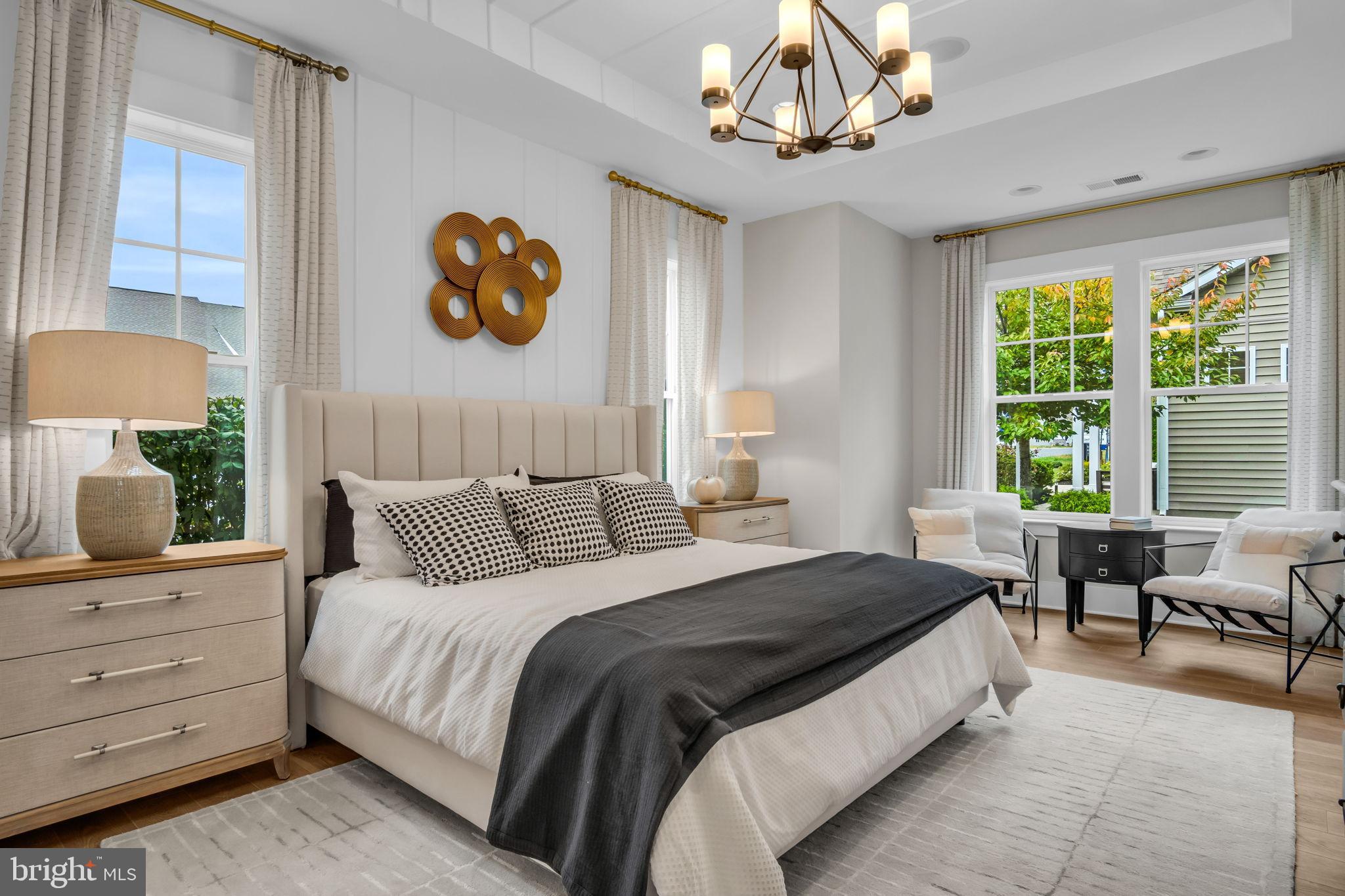 39 Reedgrass Way Gettysburg, PA 17325 - Photo 5 of 44 a bedroom with a large bed and a chandelier