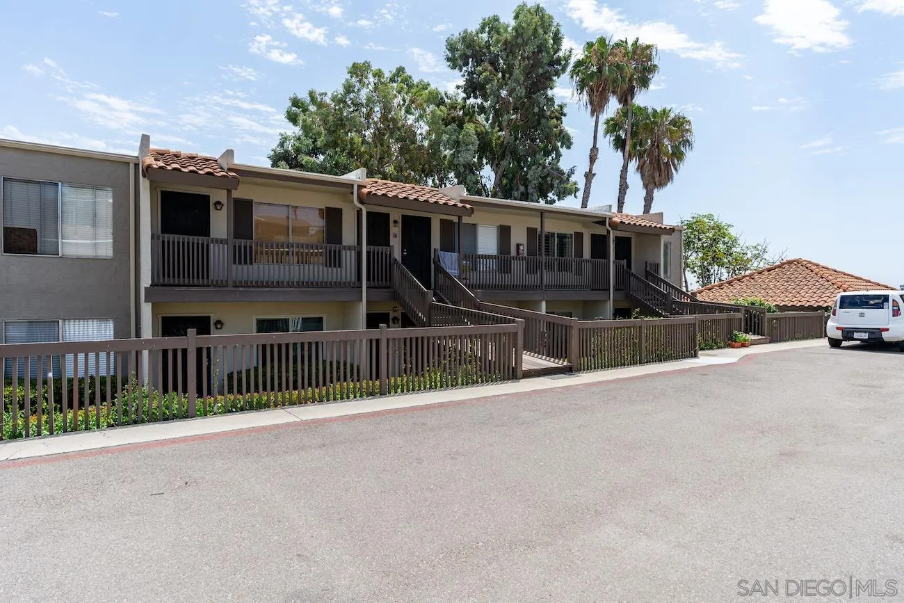 615 Vine Street, Unit 15 Oceanside, CA 92054 - Photo 16 of 23 a view of a house with a wooden fence