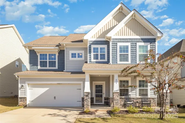 a view of kitchen with stove and wooden floor