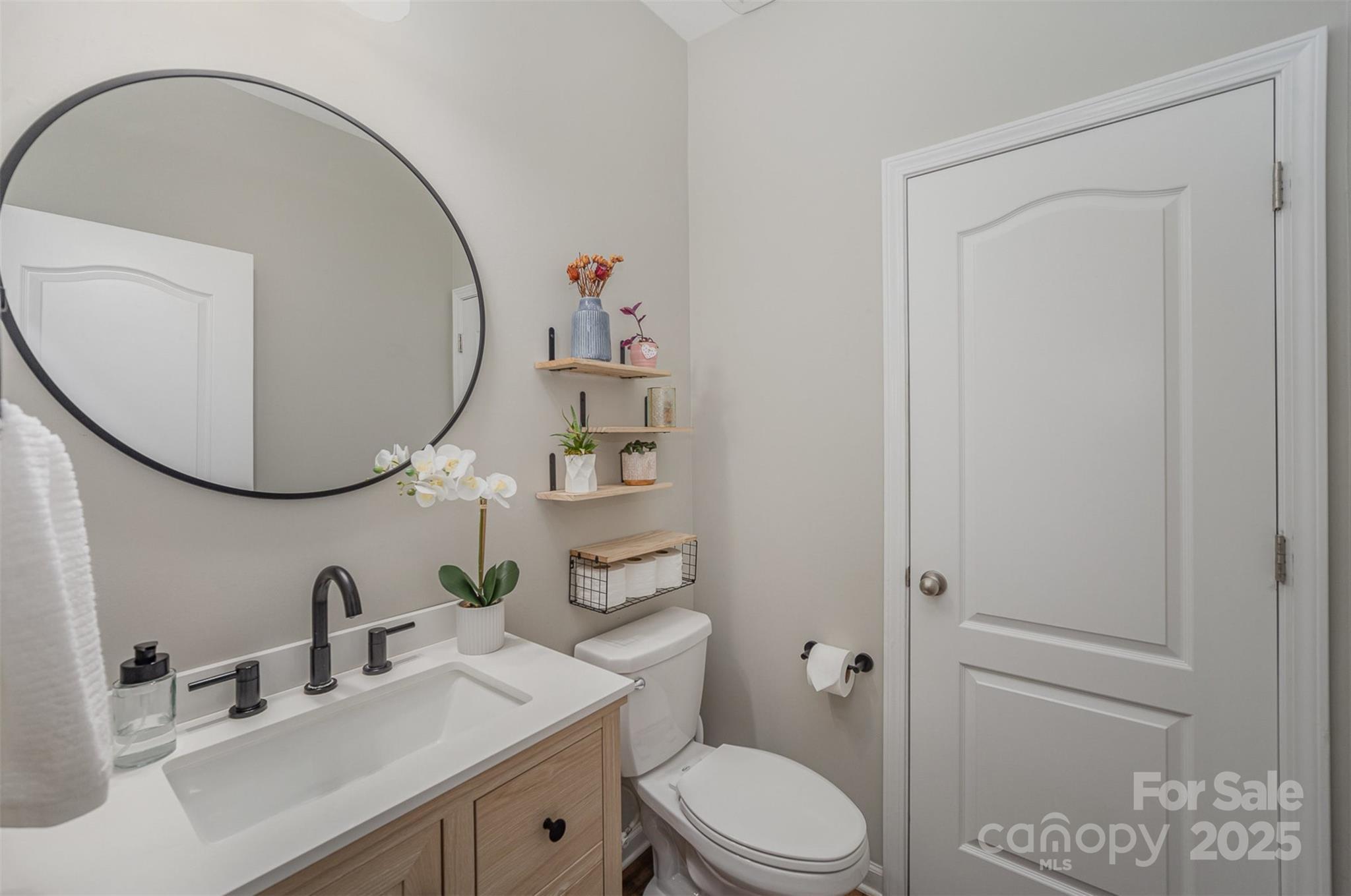810 Braddock Way Fort Mill, SC 29715 - Photo 18 of 38 a bathroom with a sink a toilet and a mirror