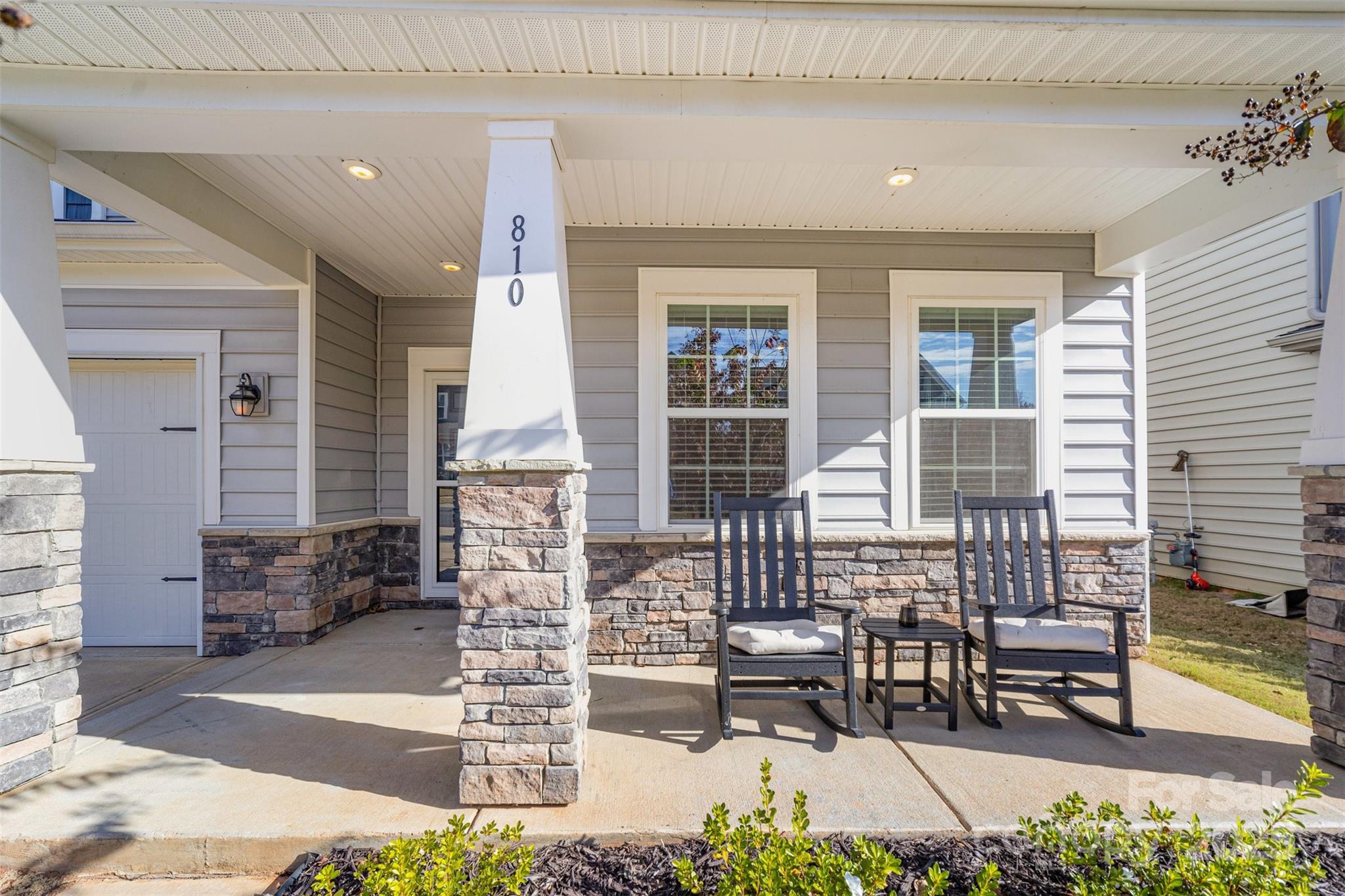 810 Braddock Way Fort Mill, SC 29715 - Photo 2 of 38 a front view of a house with outdoor seating