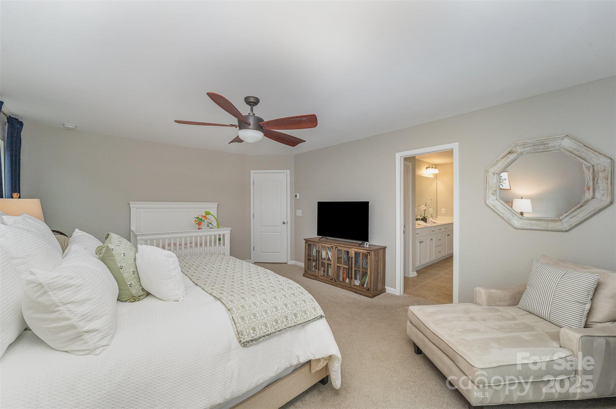810 Braddock Way Fort Mill, SC 29715 - Photo 22 of 38 a bedroom with a bed and a flat screen tv
