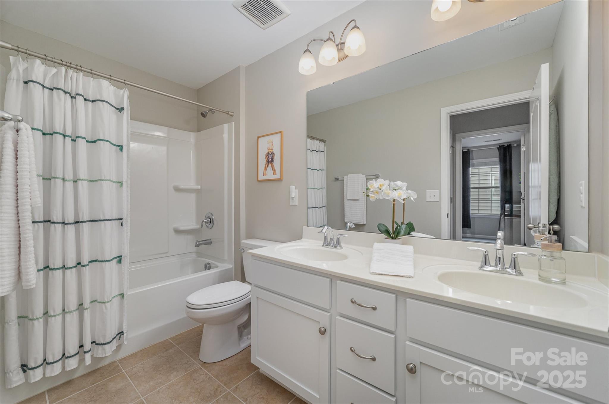 810 Braddock Way Fort Mill, SC 29715 - Photo 28 of 38 a spacious bathroom with a double vanity sink toilet mirror and shower