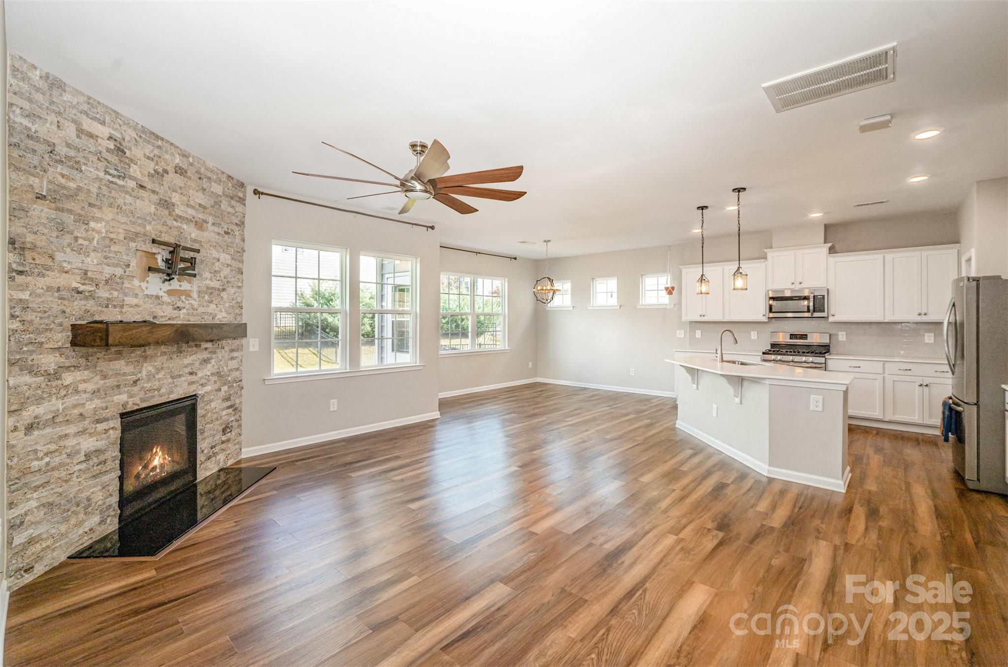 810 Braddock Way Fort Mill, SC 29715 - Photo 4 of 38 a view of kitchen with stove and wooden floor