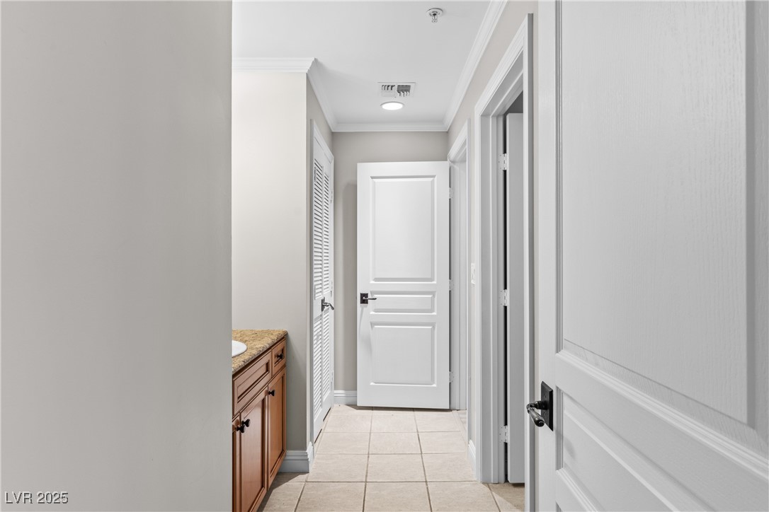35 Strada Di Circolo Henderson, NV 89011 - Photo 20 of 28 Hall featuring CROWN molding and light tile patterned floors