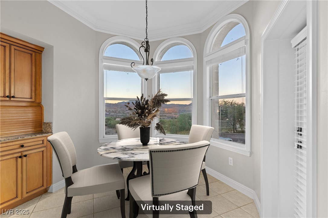 35 Strada Di Circolo Henderson, NV 89011 - Photo 8 of 28 Dining space with light tile patterned floors and ornamental molding