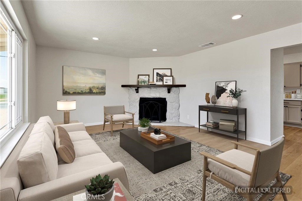 21985 Maumee Road Apple Valley, CA 92308 - Photo 4 of 28 Living Room (Disclaimer: Some images have been digitally enhanced with virtual staging to illustrate potential room layouts and furnishings. Actual property condition and features may vary. Buyer to verify all information independently).