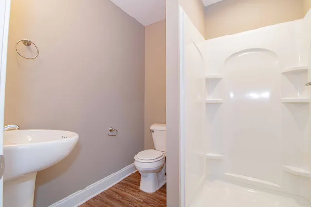 a bathroom with a toilet a sink and a bathtub