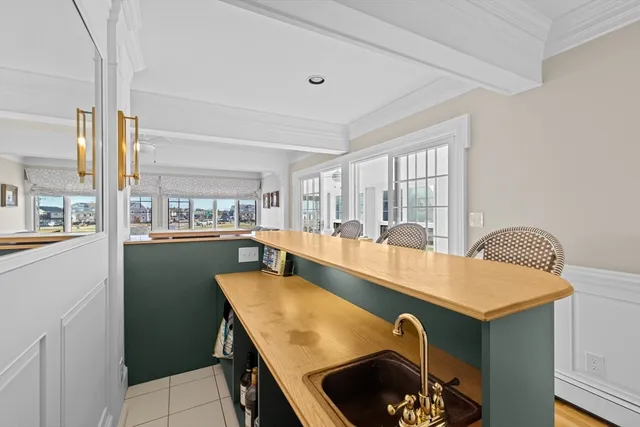 a dining room with a table and chairs