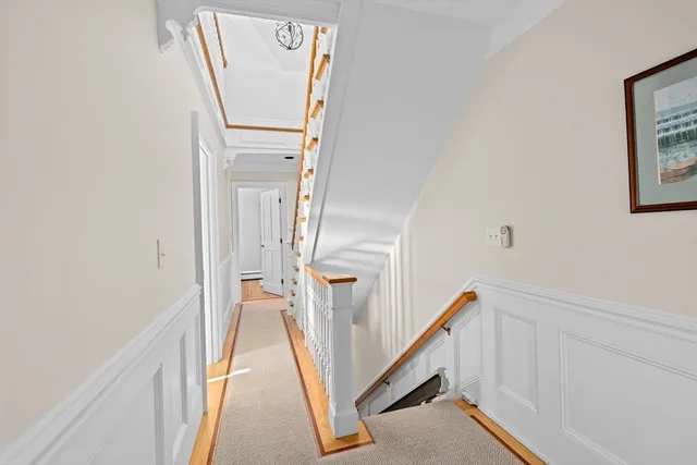 a view of a hallway with staircase