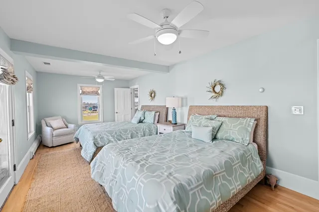 a bedroom with bed and a chandelier