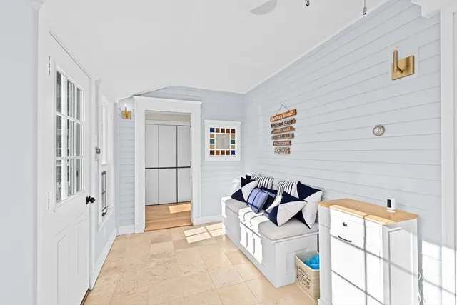 a bedroom with furniture and a window