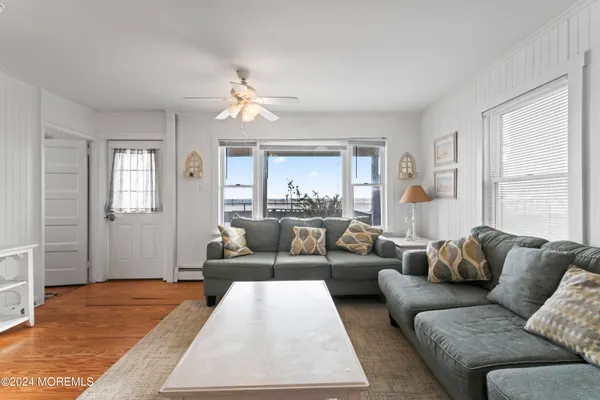 a living room with furniture and a table