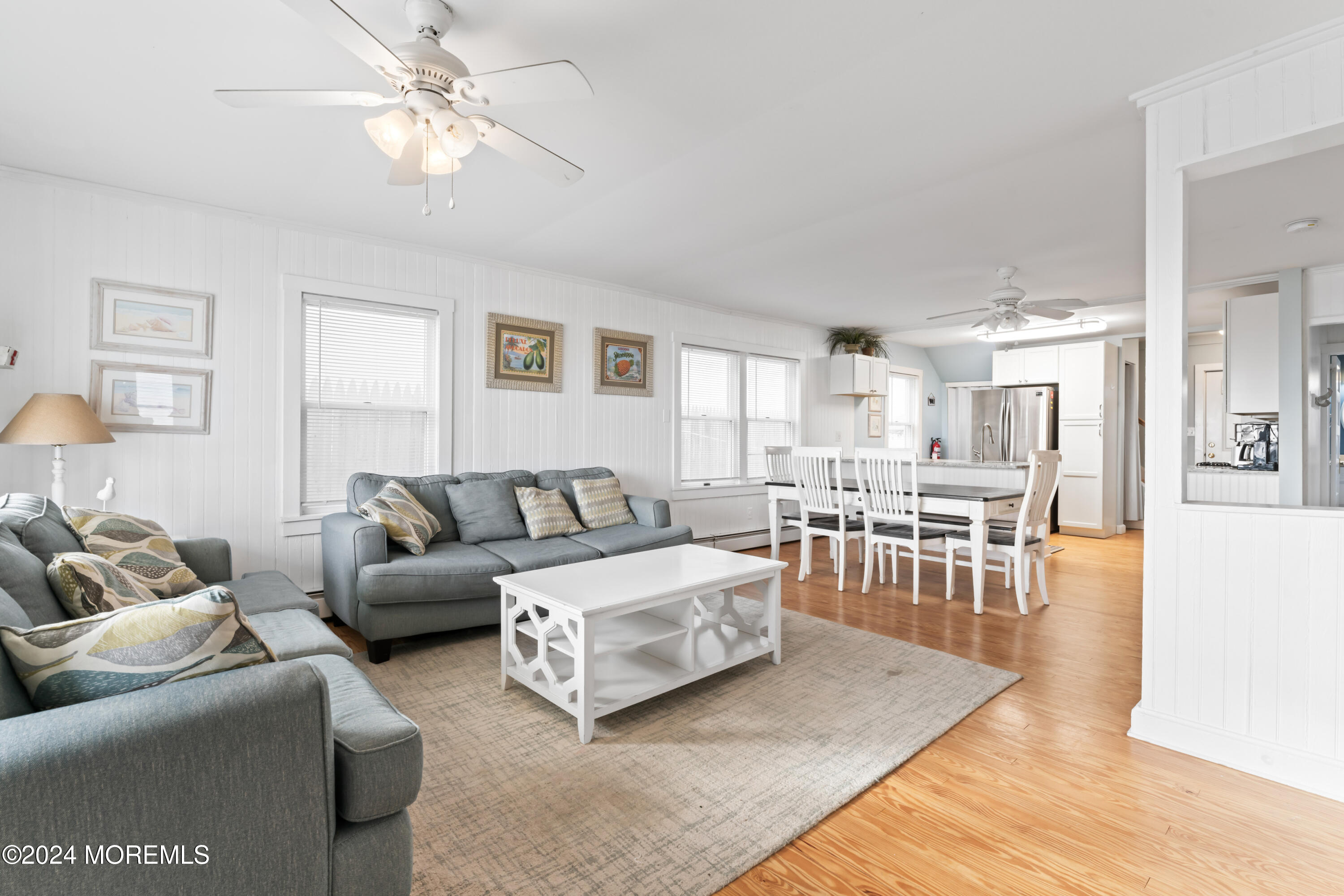 255 Boardwalk Point Pleasant Beach, NJ 08742 - Photo 12 of 34 a living room with furniture and a table