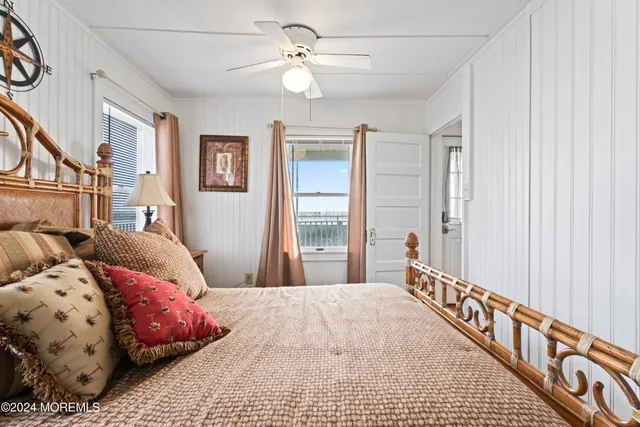 a bedroom with bed and a window