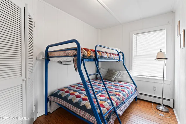 a bathroom with a toilet a sink and a mirror