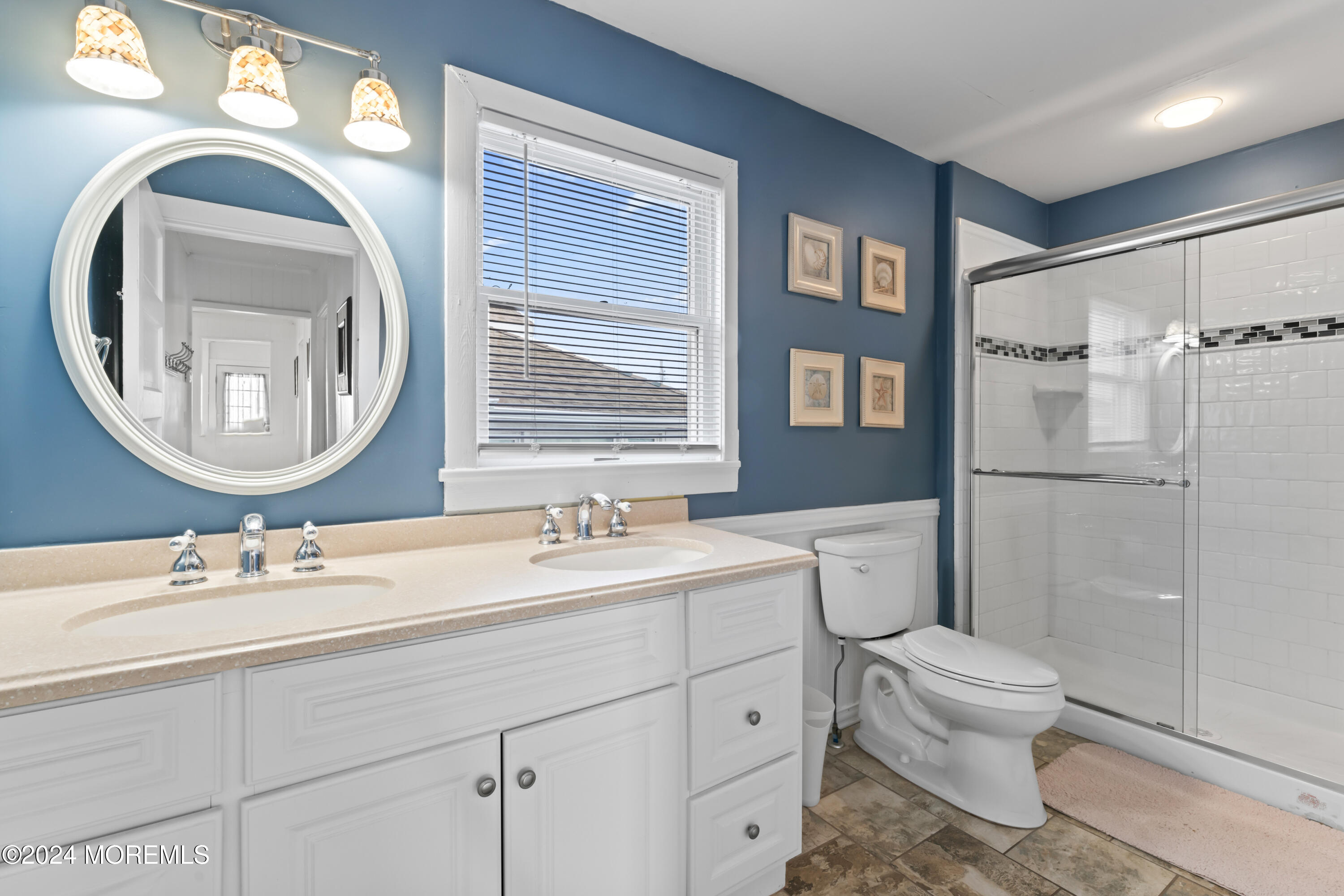 255 Boardwalk Point Pleasant Beach, NJ 08742 - Photo 18 of 34 a bathroom with a toilet a sink and a mirror