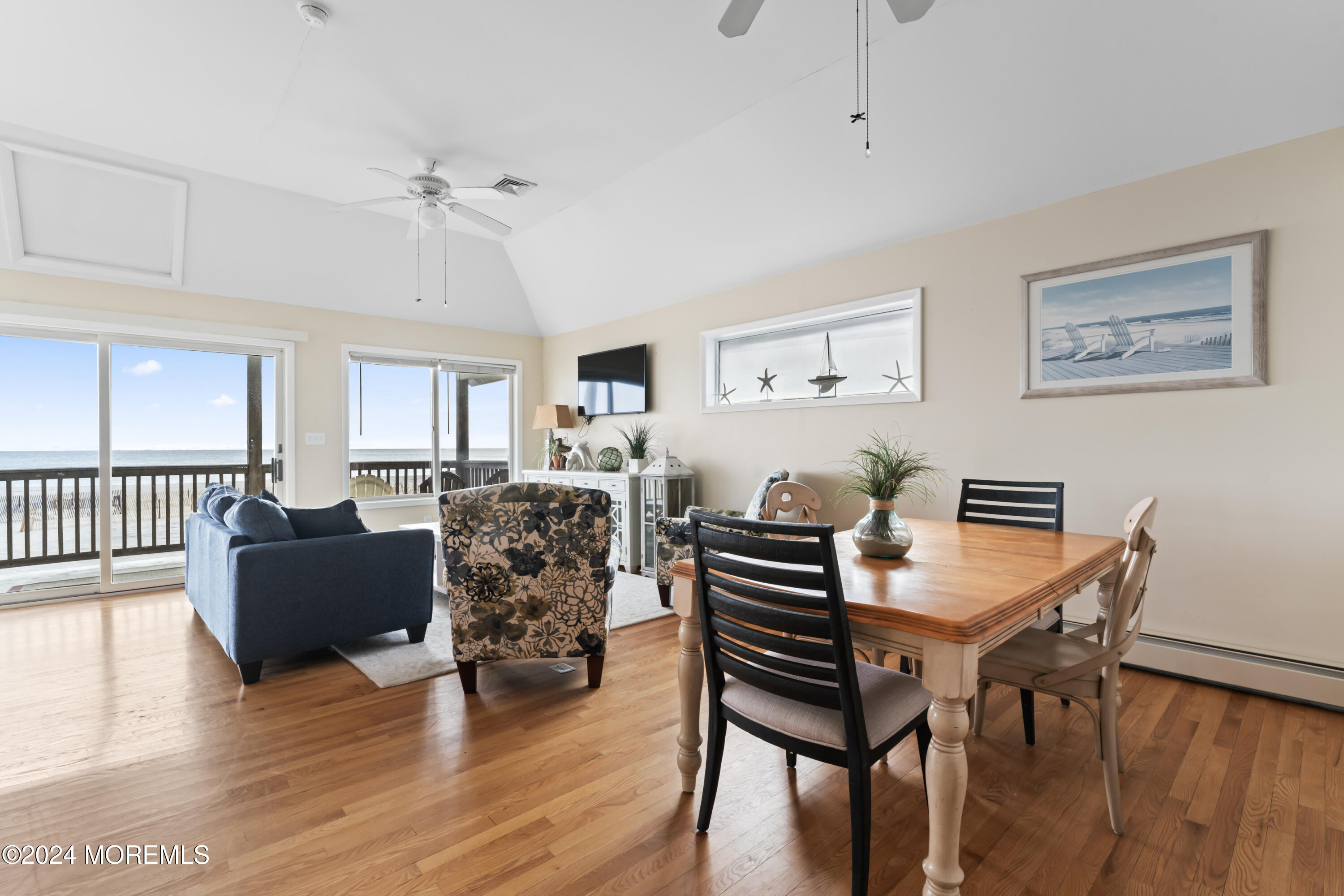 255 Boardwalk Point Pleasant Beach, NJ 08742 - Photo 21 of 34 a view of a dining room with furniture and wooden floor