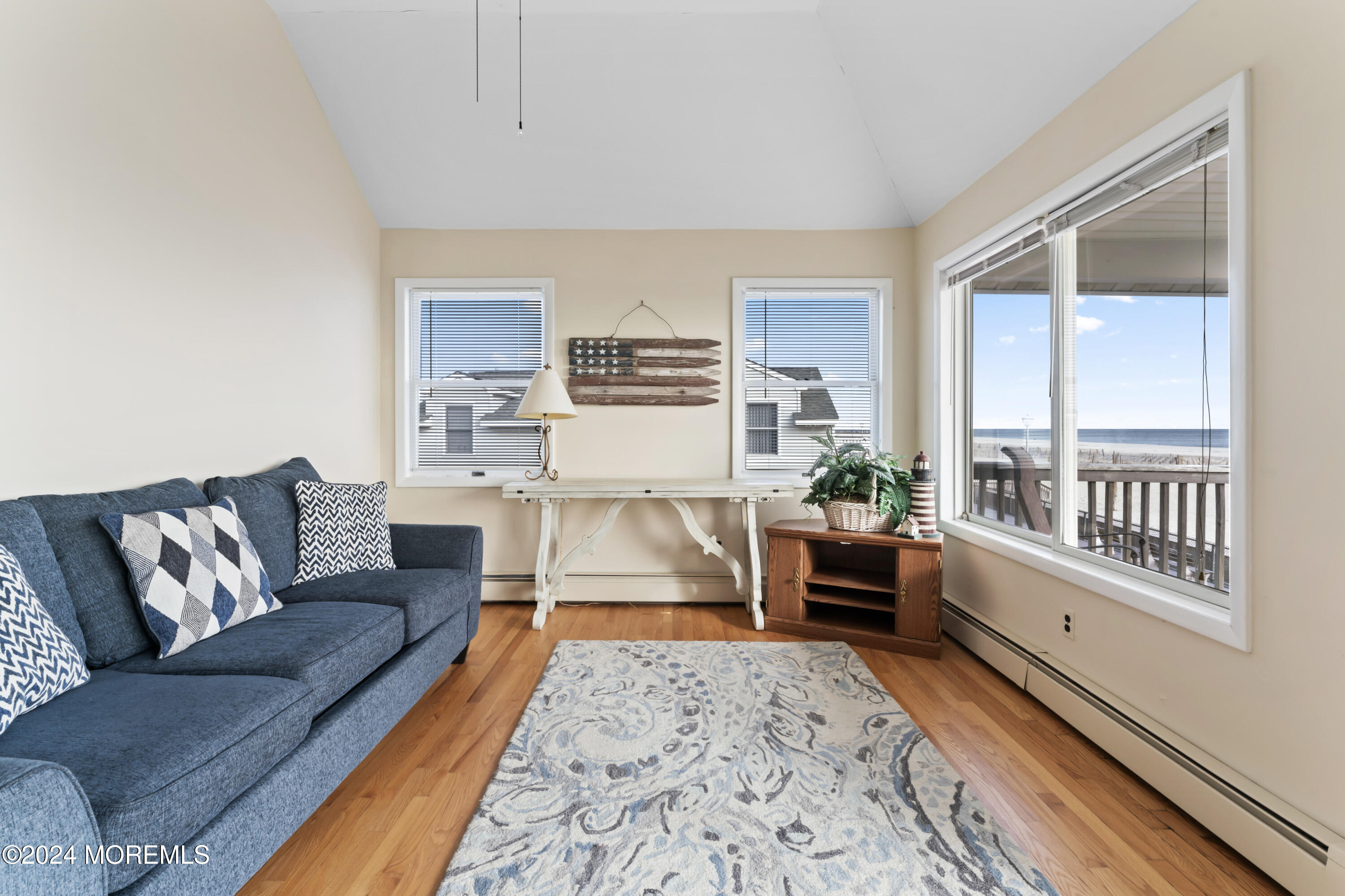 255 Boardwalk Point Pleasant Beach, NJ 08742 - Photo 23 of 34 a living room with furniture and a wooden floor