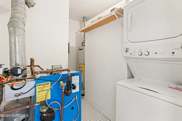 a front view of a building with cars parked