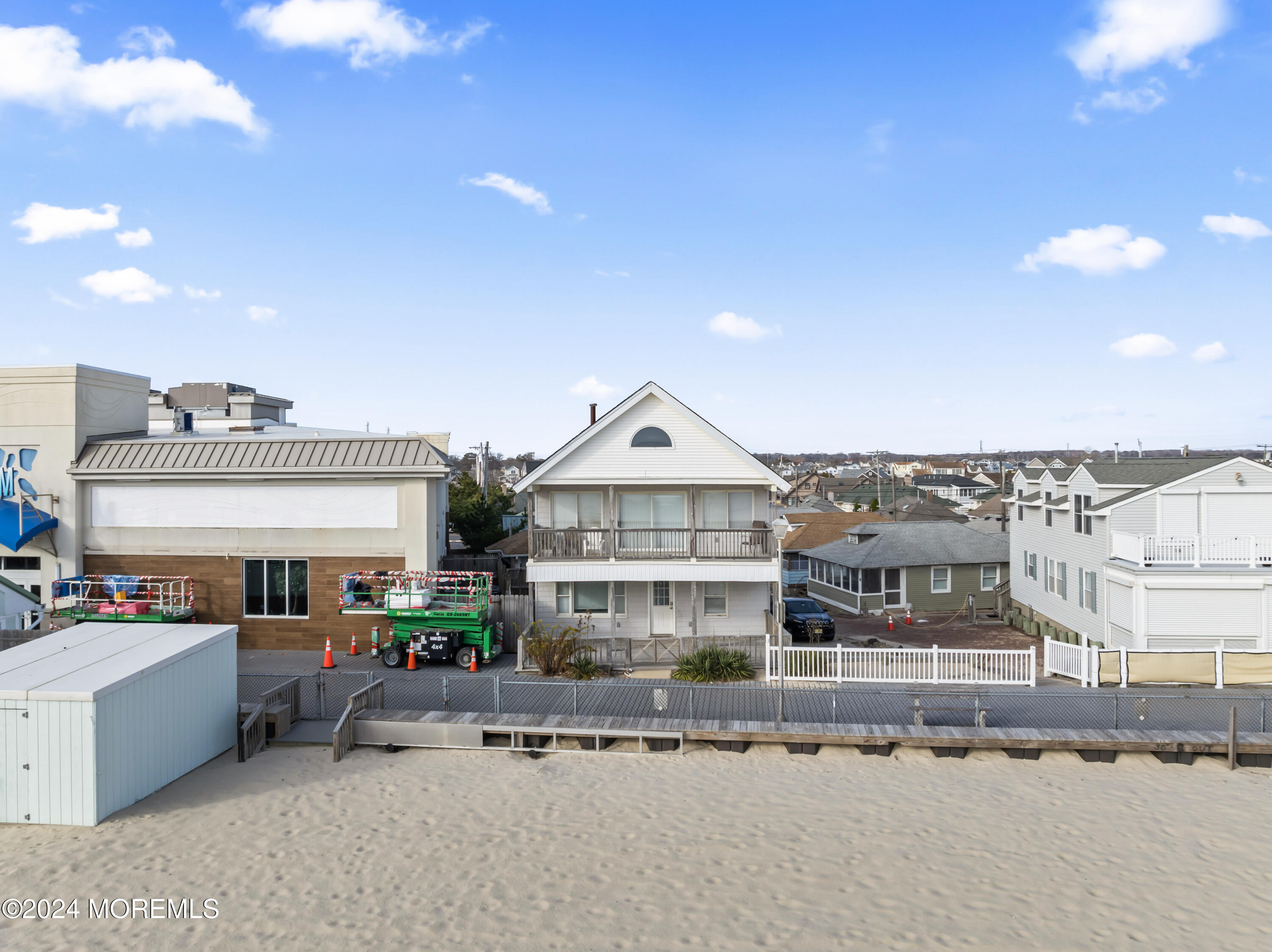 255 Boardwalk Point Pleasant Beach, NJ 08742 - Photo 28 of 34 a front view of a building with cars parked
