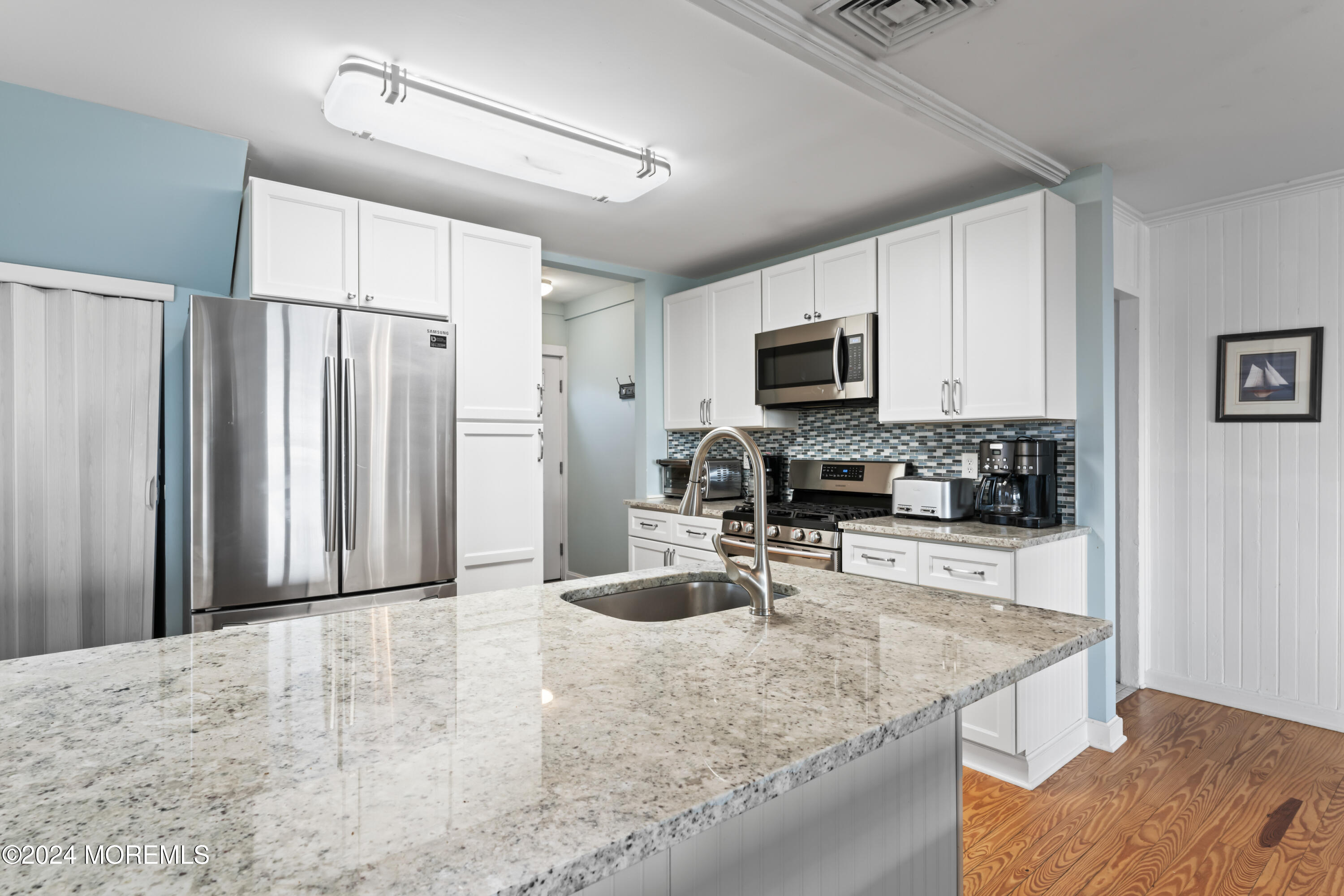 255 Boardwalk Point Pleasant Beach, NJ 08742 - Photo 9 of 34 a kitchen with stainless steel appliances granite countertop a refrigerator stove and sink